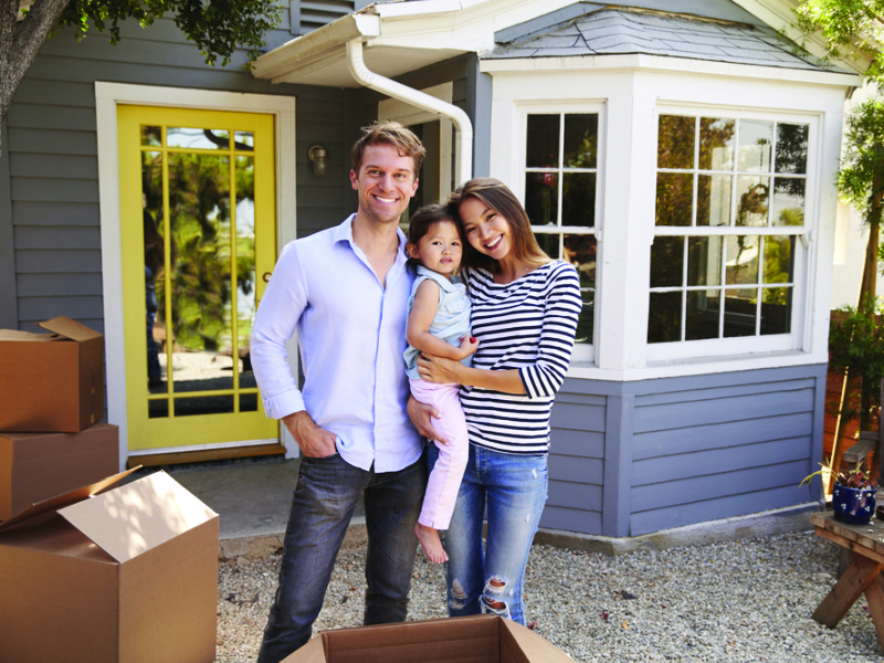 America Mortgages happy family in front of property in the US