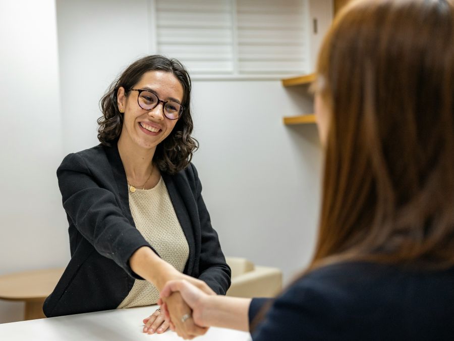 Professional mortgage loan officer speaking with clients