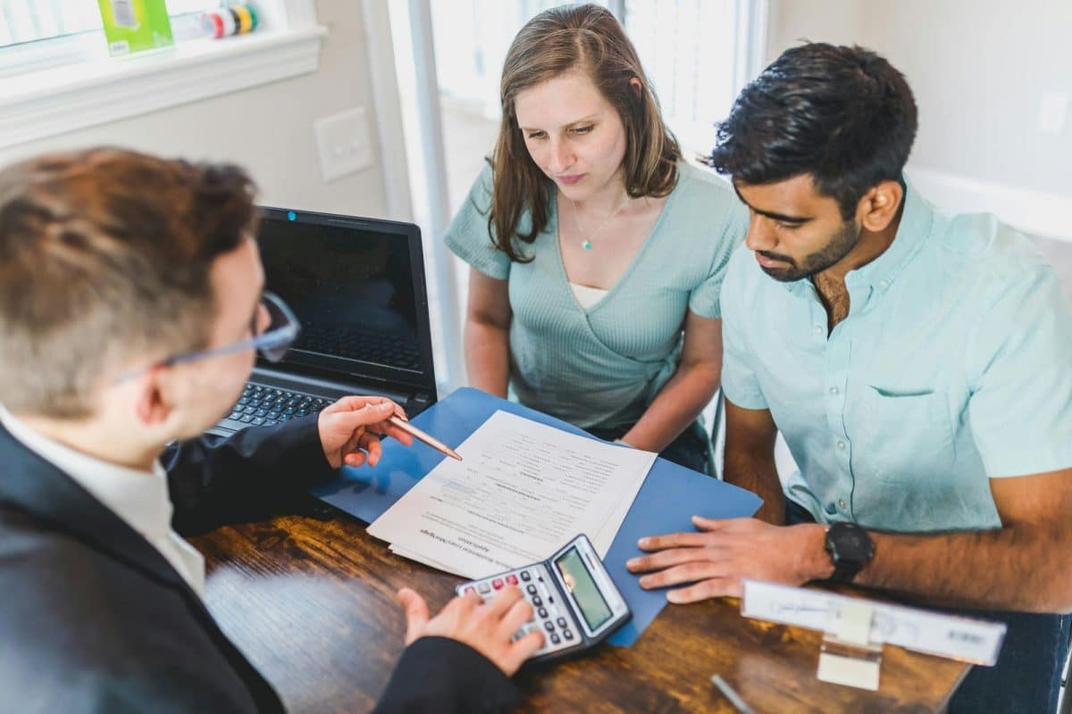 Real estate investor comparing portfolio loan and traditional mortgage financing options