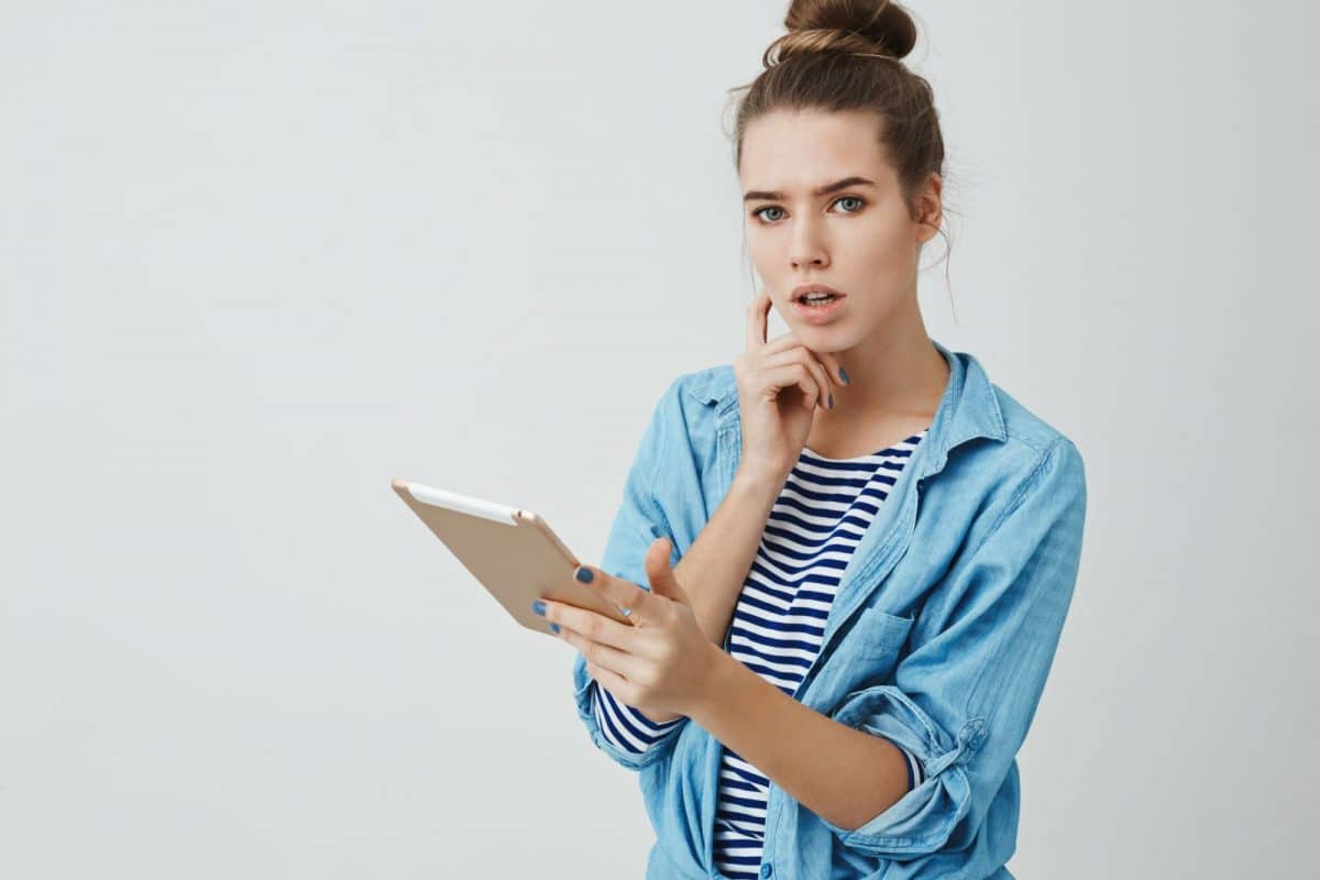International investor reviewing frequently asked questions about US mortgages, DSCR loans, LLC ownership, and real estate investing